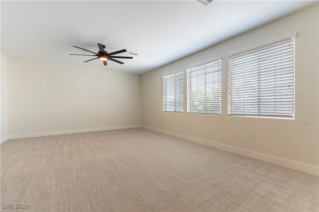9632 Staff Lane Las Vegas, NV 89178 - Photo 23 of 53 Unfurnished room with light carpet and ceiling fan