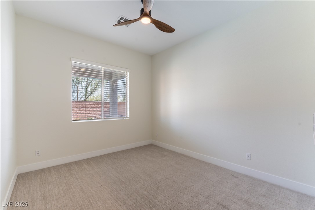 9632 Staff Lane Las Vegas, NV 89178 - Photo 28 of 53 Spare room featuring light carpet and ceiling fan