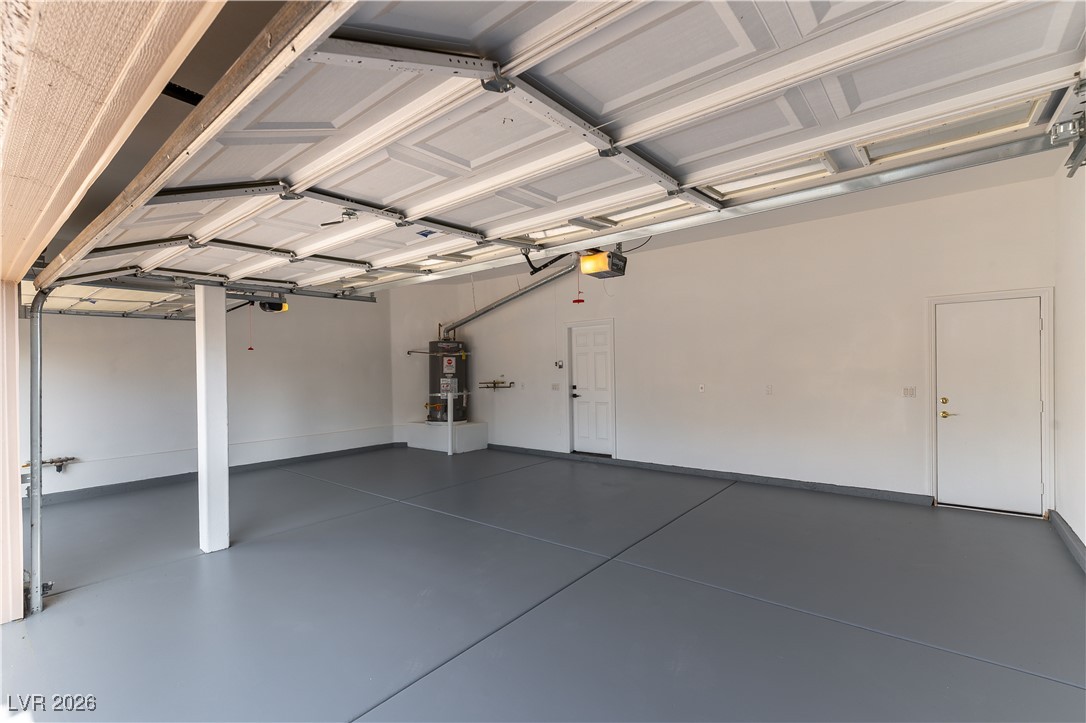 9632 Staff Lane Las Vegas, NV 89178 - Photo 32 of 53 Garage with strapped water heater