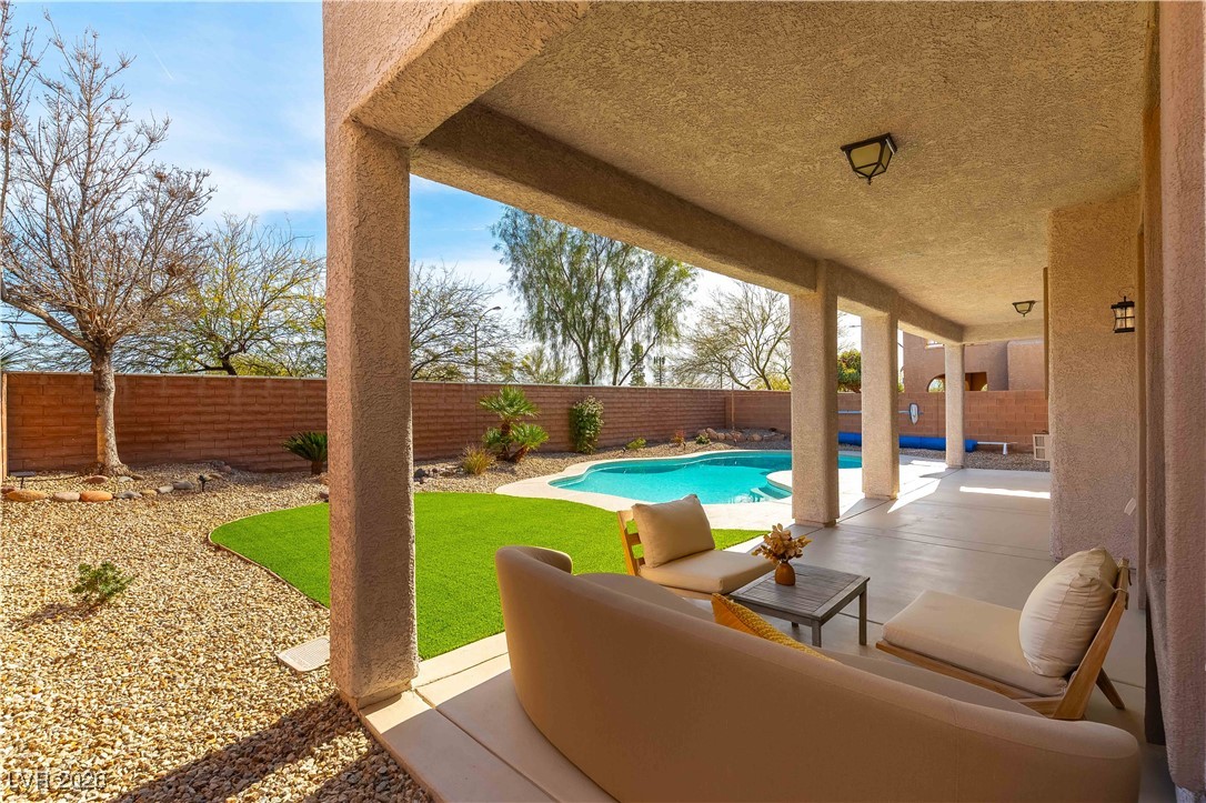 9632 Staff Lane Las Vegas, NV 89178 - Photo 34 of 53 Fenced backyard featuring a patio area and an outdoor living space