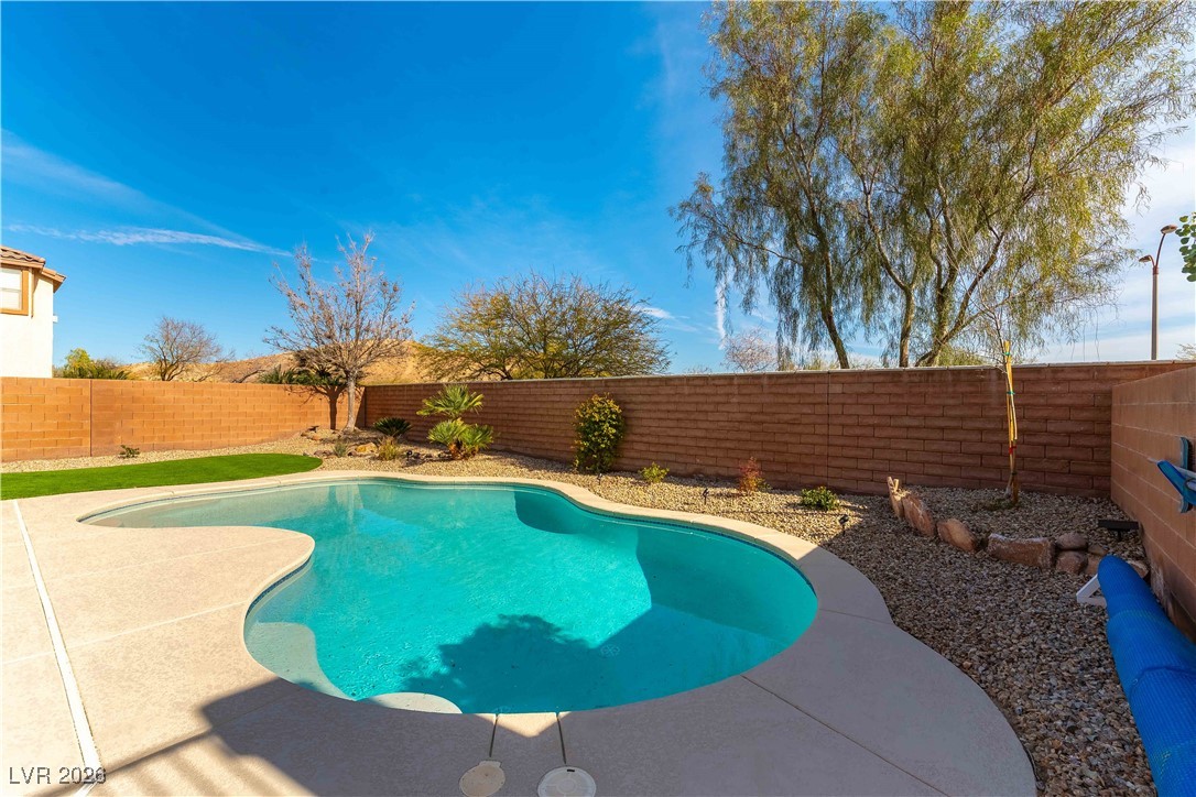 9632 Staff Lane Las Vegas, NV 89178 - Photo 35 of 53 View of pool with a fenced backyard and a patio area