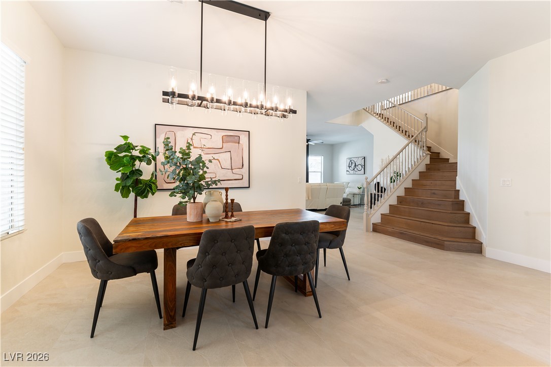 9632 Staff Lane Las Vegas, NV 89178 - Photo 7 of 53 Dining room featuring stairway and a ceiling fan