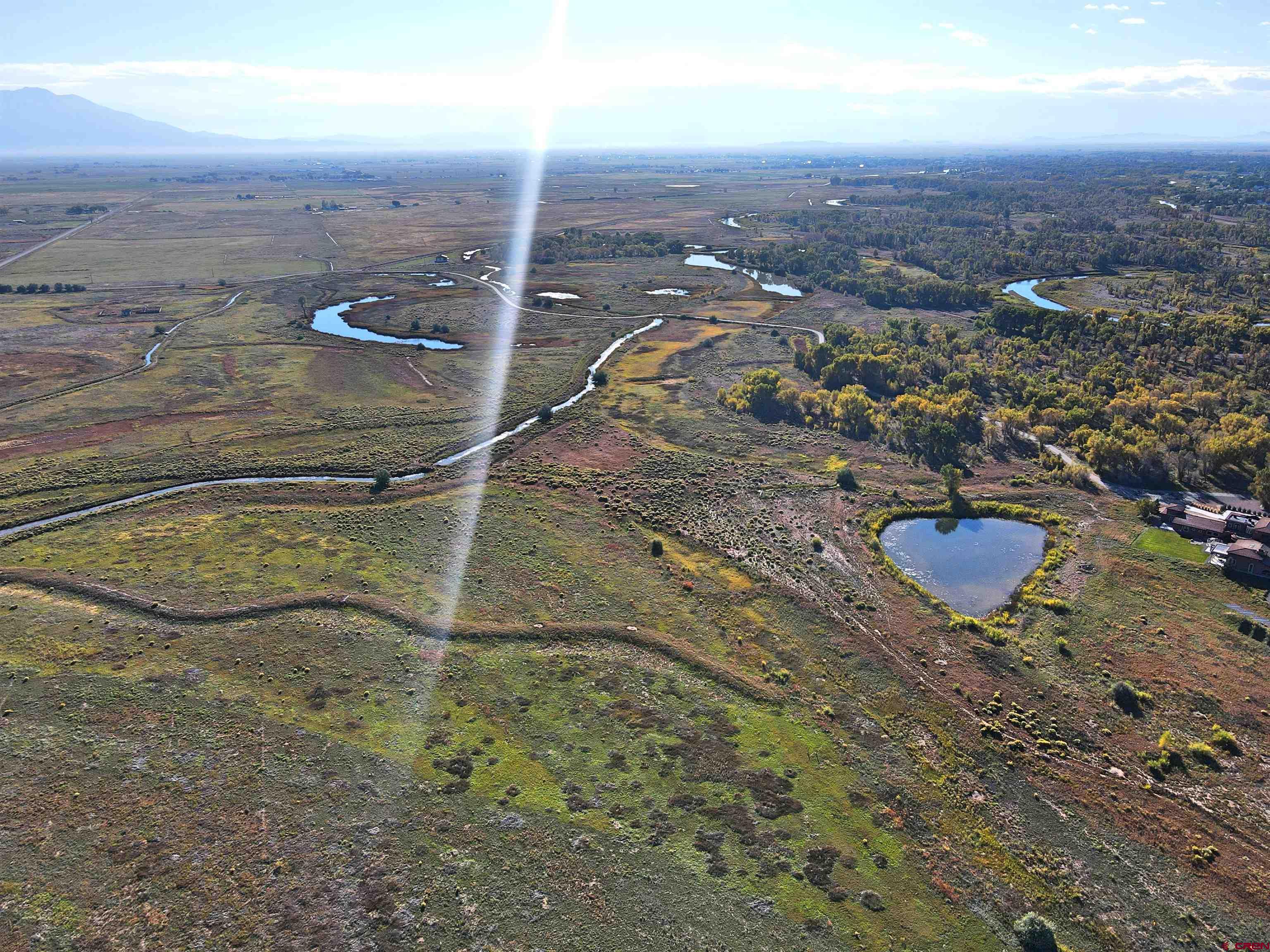 Tbd Tbd Oxbow Loop Alamosa, CO 81101 - Photo 1 of 7 an aerial view of residential houses with outdoor space