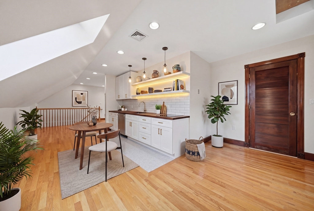 131 Range Heights Road Lynn, MA 01904 - Photo 22 of 36 a living room with furniture and a potted plant