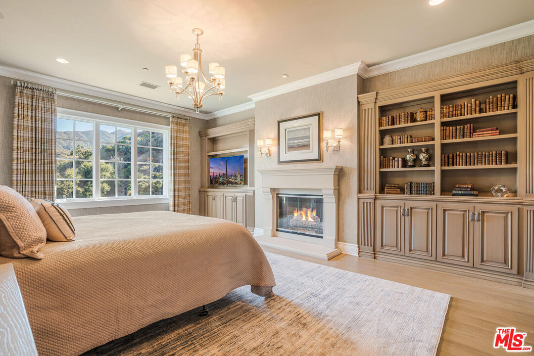 3063 West Stafford Road Thousand Oaks, CA 91361 - Photo 12 of 19 a spacious bedroom with a large bed and a fireplace