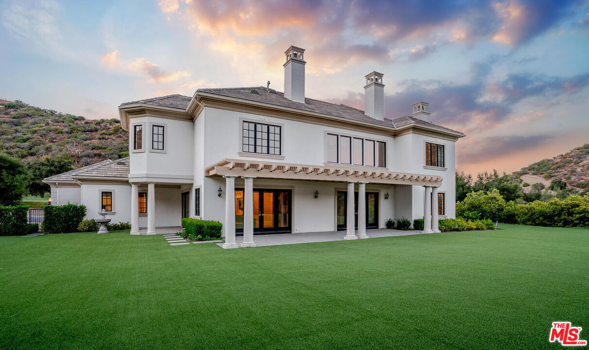 3063 West Stafford Road Thousand Oaks, CA 91361 - Photo 2 of 19 a front view of a house with a garden