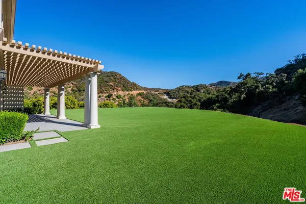 a view of a porch with a yard