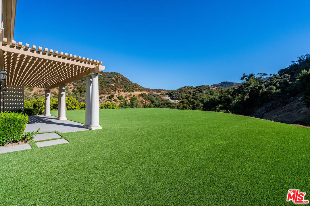 3063 West Stafford Road Thousand Oaks, CA 91361 - Photo 3 of 19 a view of a porch with a yard