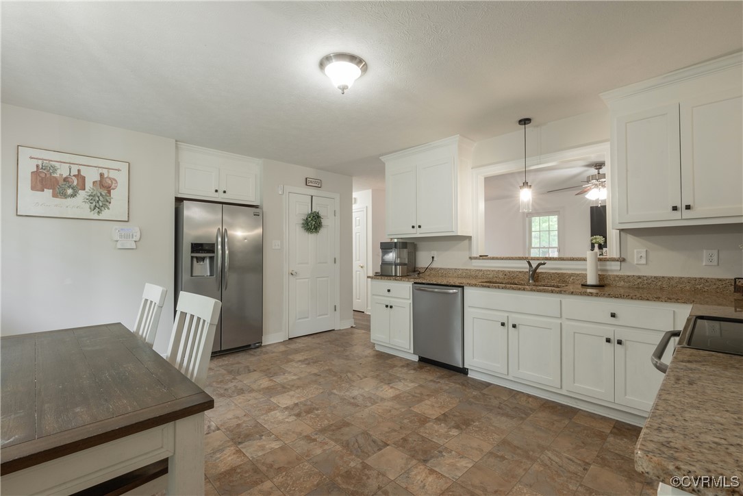 1315 Mill Road Aylett, VA 23086 - Photo 20 of 33 a large kitchen with cabinets and stainless steel appliances