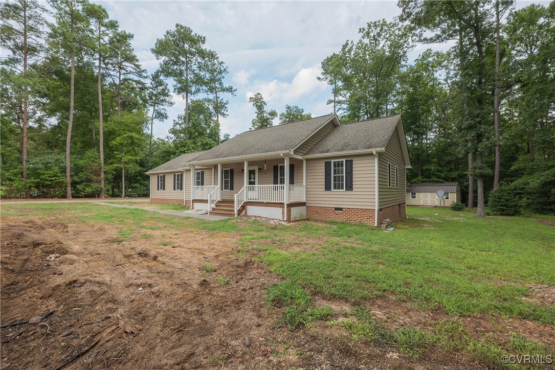 1315 Mill Road Aylett, VA 23086 - Photo 2 of 33 a front view of a house with a garden