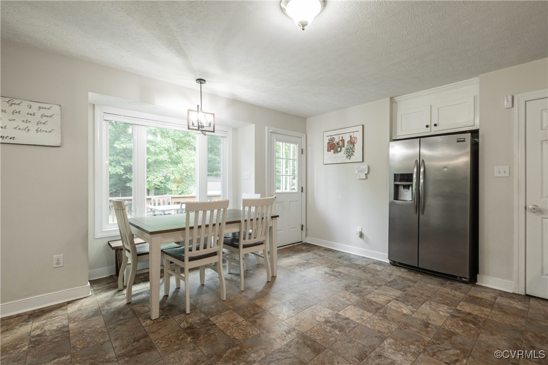 1315 Mill Road Aylett, VA 23086 - Photo 21 of 33 a view of a dining room with furniture window and outside view
