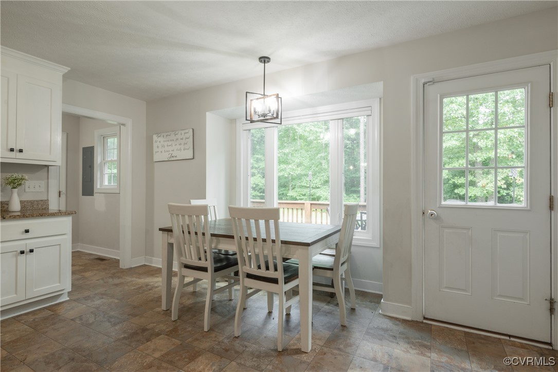 1315 Mill Road Aylett, VA 23086 - Photo 22 of 33 a view of a dining room with furniture window and outside view
