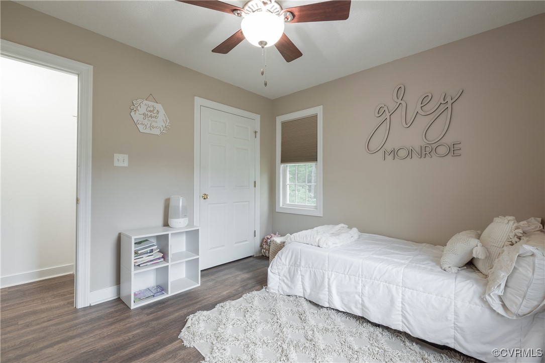 1315 Mill Road Aylett, VA 23086 - Photo 28 of 33 a bedroom with a bed and a chandelier