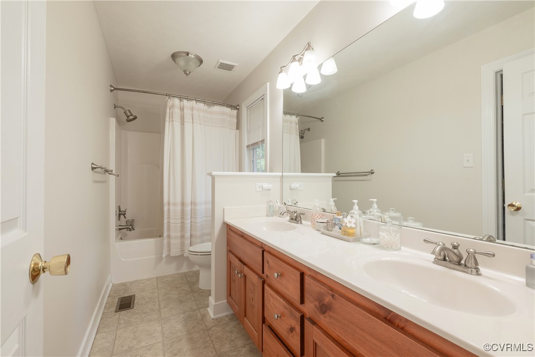 1315 Mill Road Aylett, VA 23086 - Photo 33 of 33 a bathroom with a double vanity sink mirror and shower
