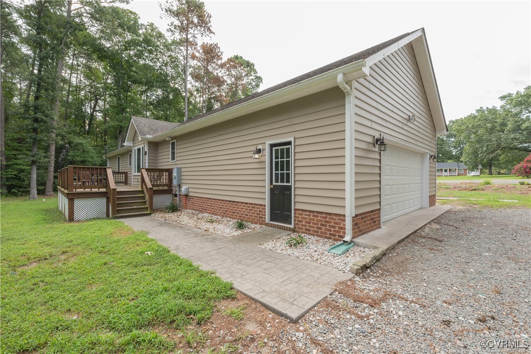 1315 Mill Road Aylett, VA 23086 - Photo 5 of 33 a view of backyard of house with wooden fence and a large tree