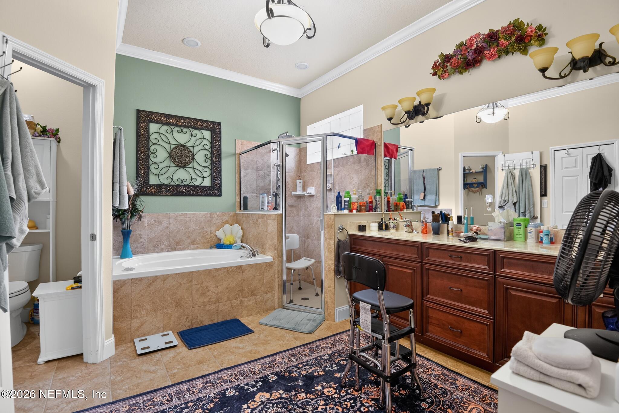 110 Vía Roma Ormond Beach, FL 32174 - Photo 24 of 43 a living room with furniture and a flat screen tv