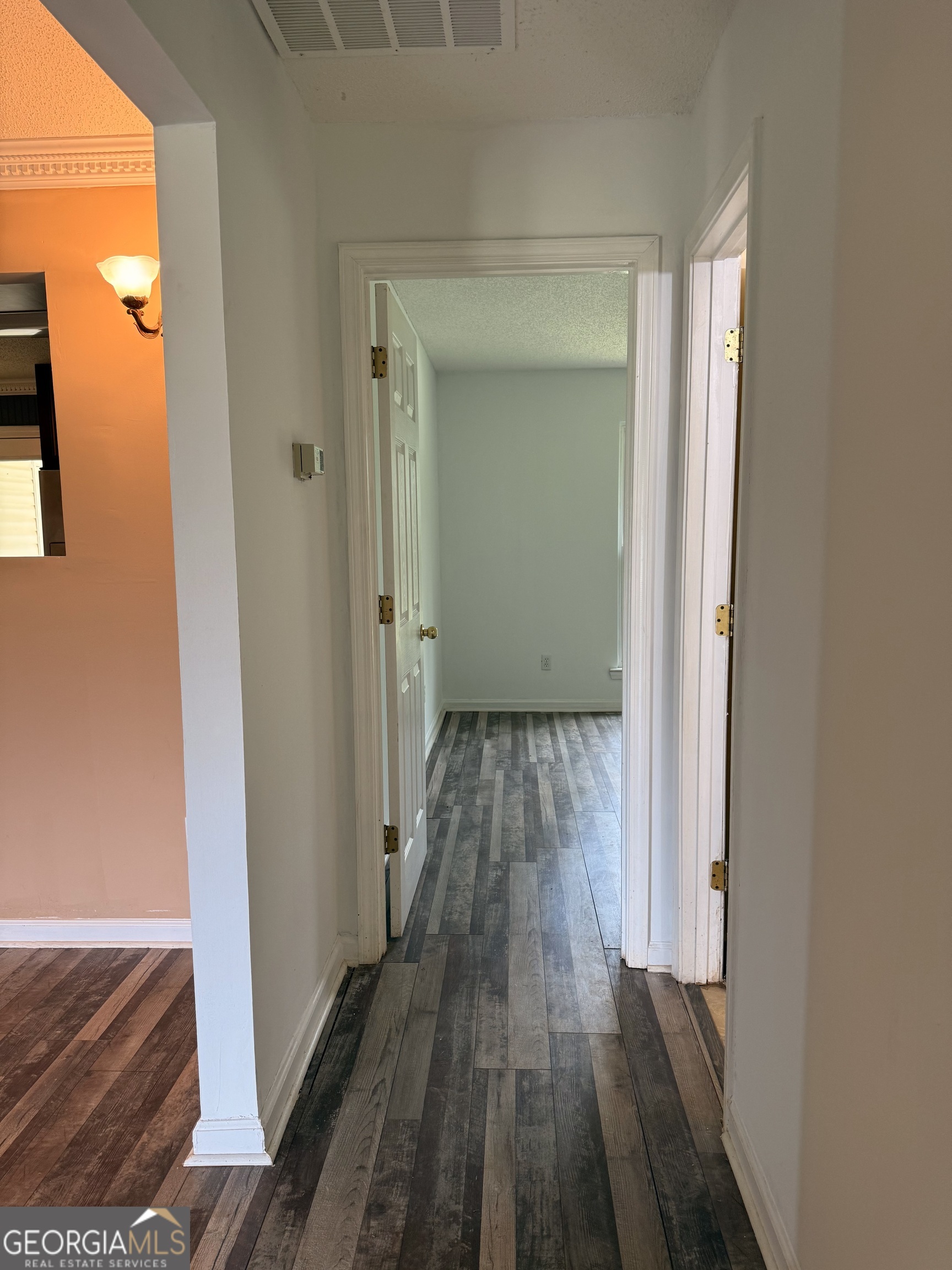 323 Snapping Shoals Road McDonough, GA 30252 - Photo 13 of 20 a view of a hallway with wooden floor and closet