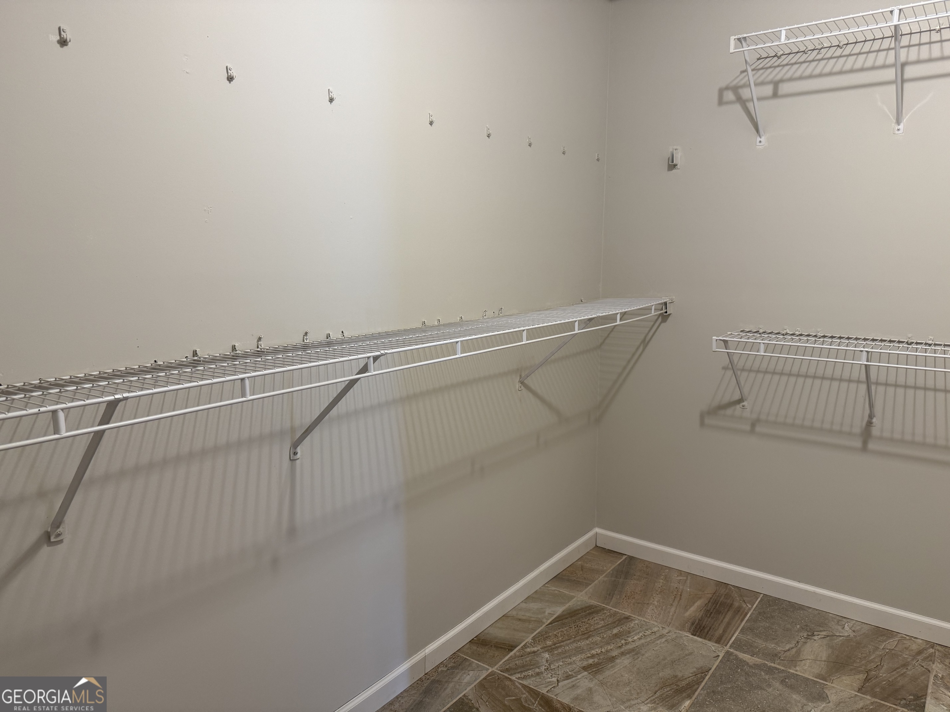 323 Snapping Shoals Road McDonough, GA 30252 - Photo 19 of 20 a view of a room with racks on the wall