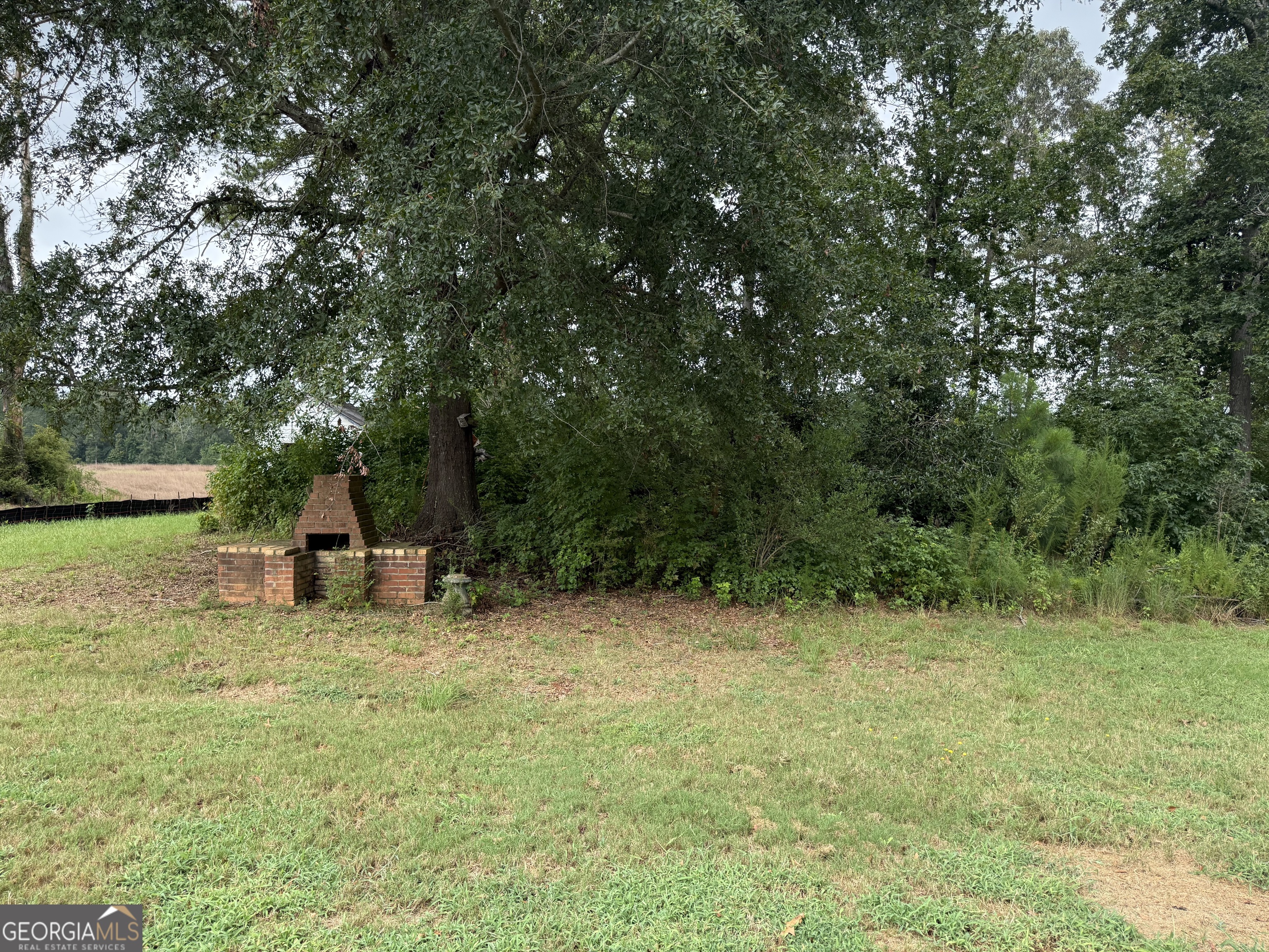 323 Snapping Shoals Road McDonough, GA 30252 - Photo 20 of 20 a view of a room with a tree and swing