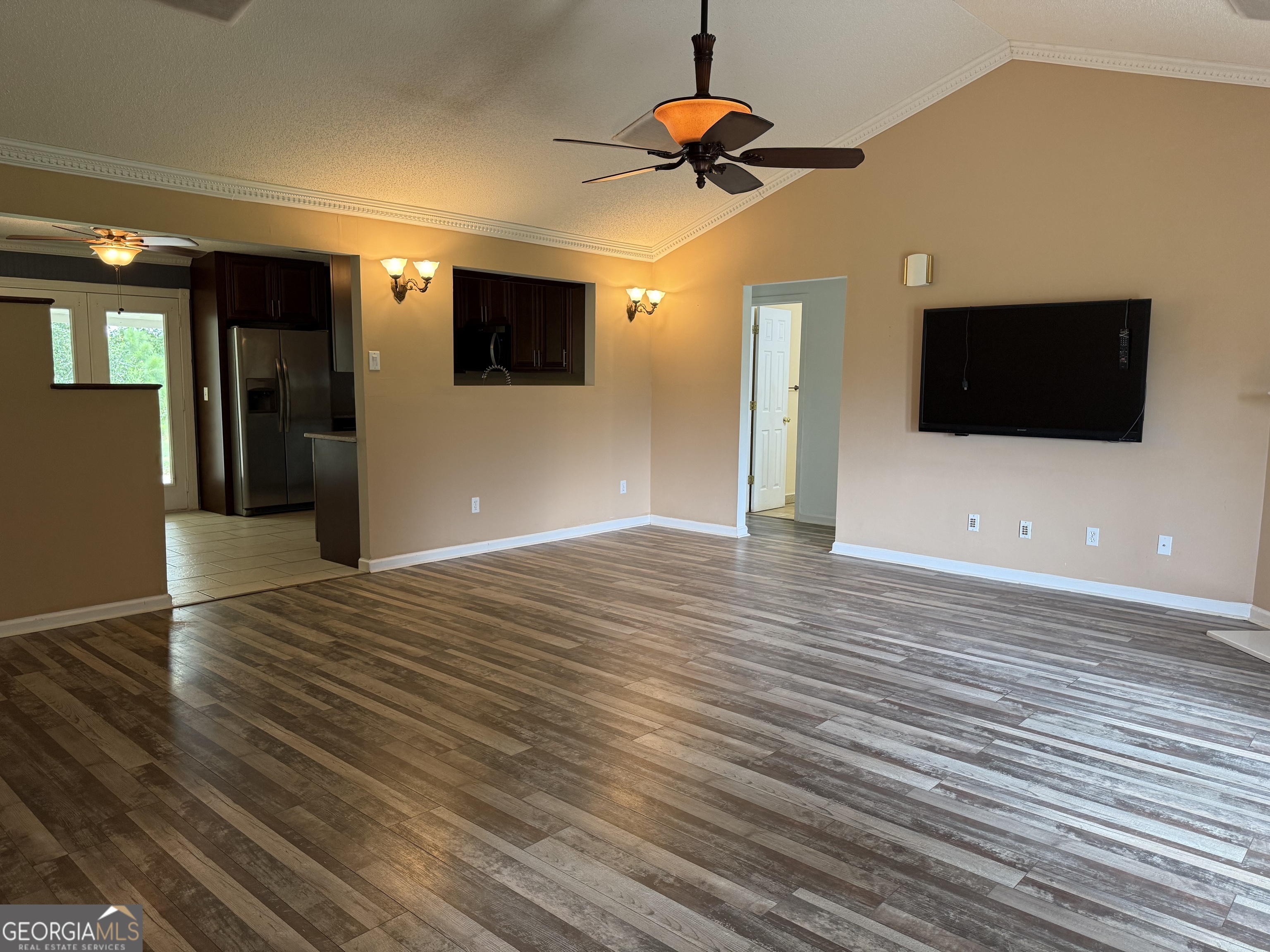 323 Snapping Shoals Road McDonough, GA 30252 - Photo 7 of 20 a view of a livingroom with a flat screen tv