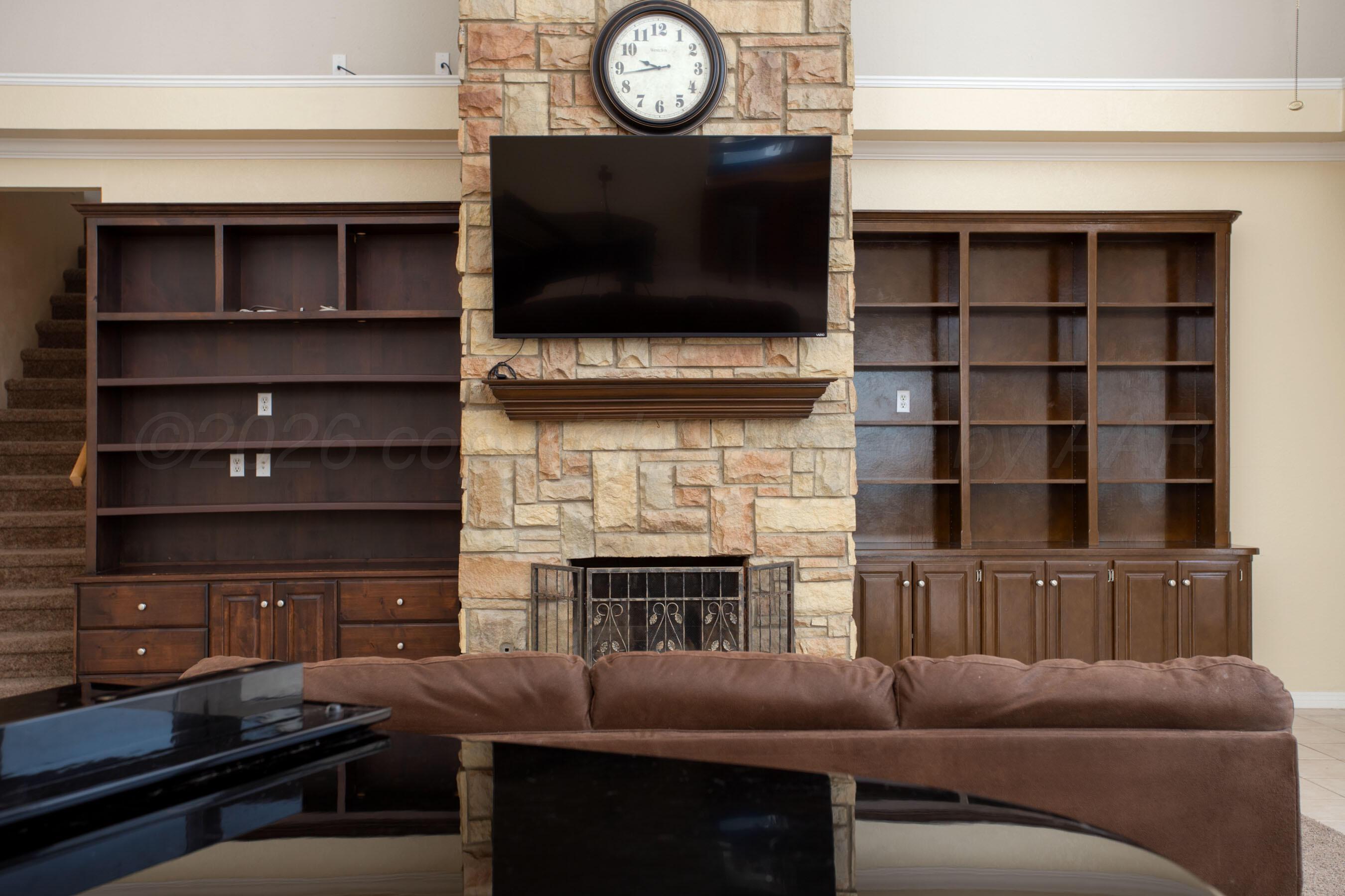 70 Stonebridge Gate Road Amarillo, TX 79124 - Photo 47 of 52 Fireplace and bookcases