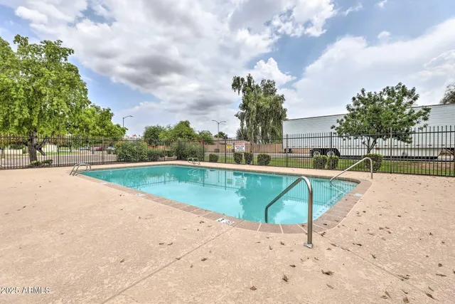 a view of a swimming pool with a lounge chairs