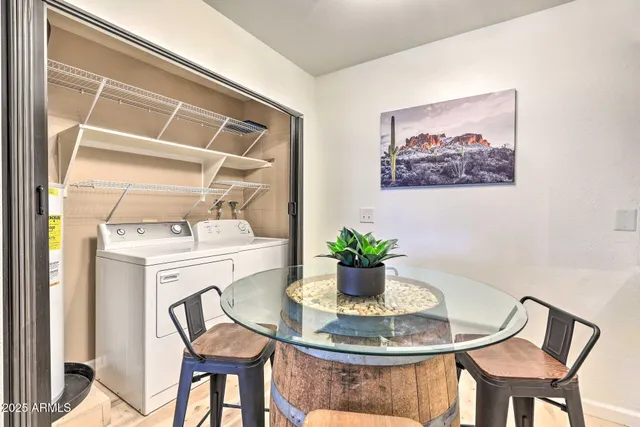 a dining room with a table and chairs