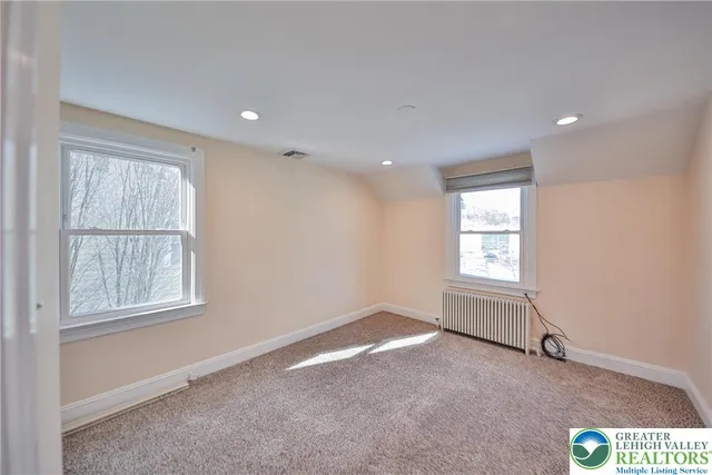 a view of empty room with windows