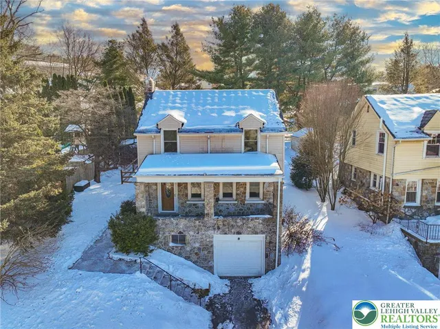 a view of a patio with table and chairs potted plants with wooden floor