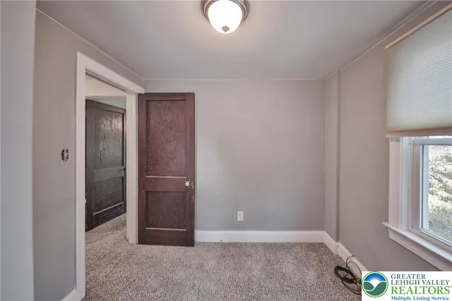 a view of a kitchen cabinets and a wooden floor