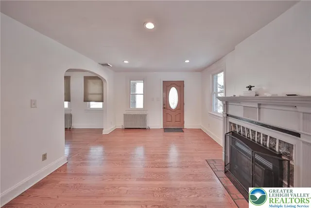 a bathroom with a sink a mirror a vanity and a shower