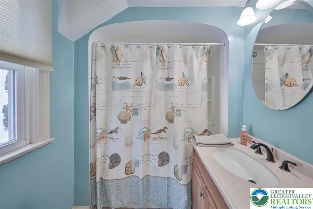 a view of a pathway with a wrought fence