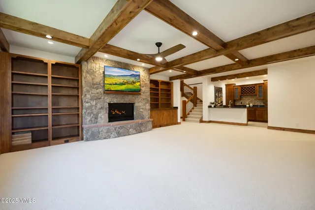 a view of a livingroom with furniture and a fireplace
