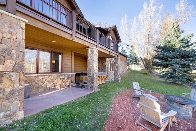 a view of a house with a yard and pathway