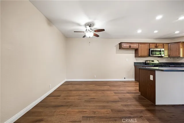 a view of kitchen with microwave and cabinets