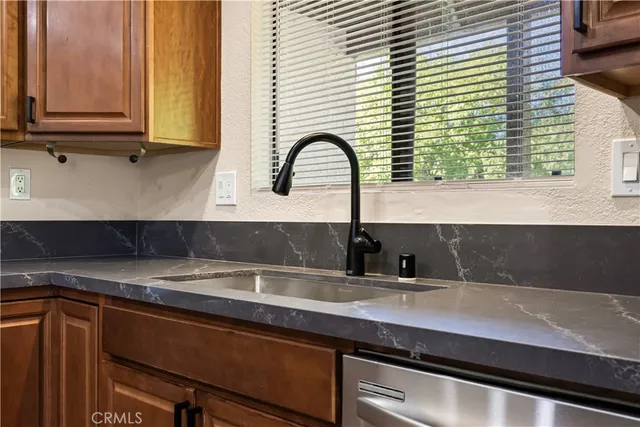 a kitchen with a sink and a window