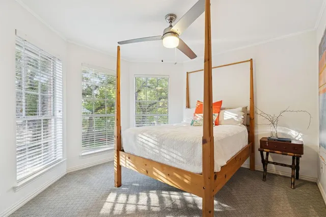 a bed room with a bed and a mirror