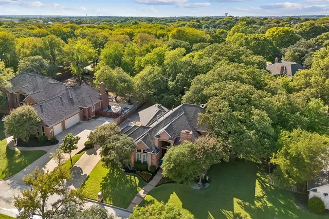 a aerial view of a house with a lake view