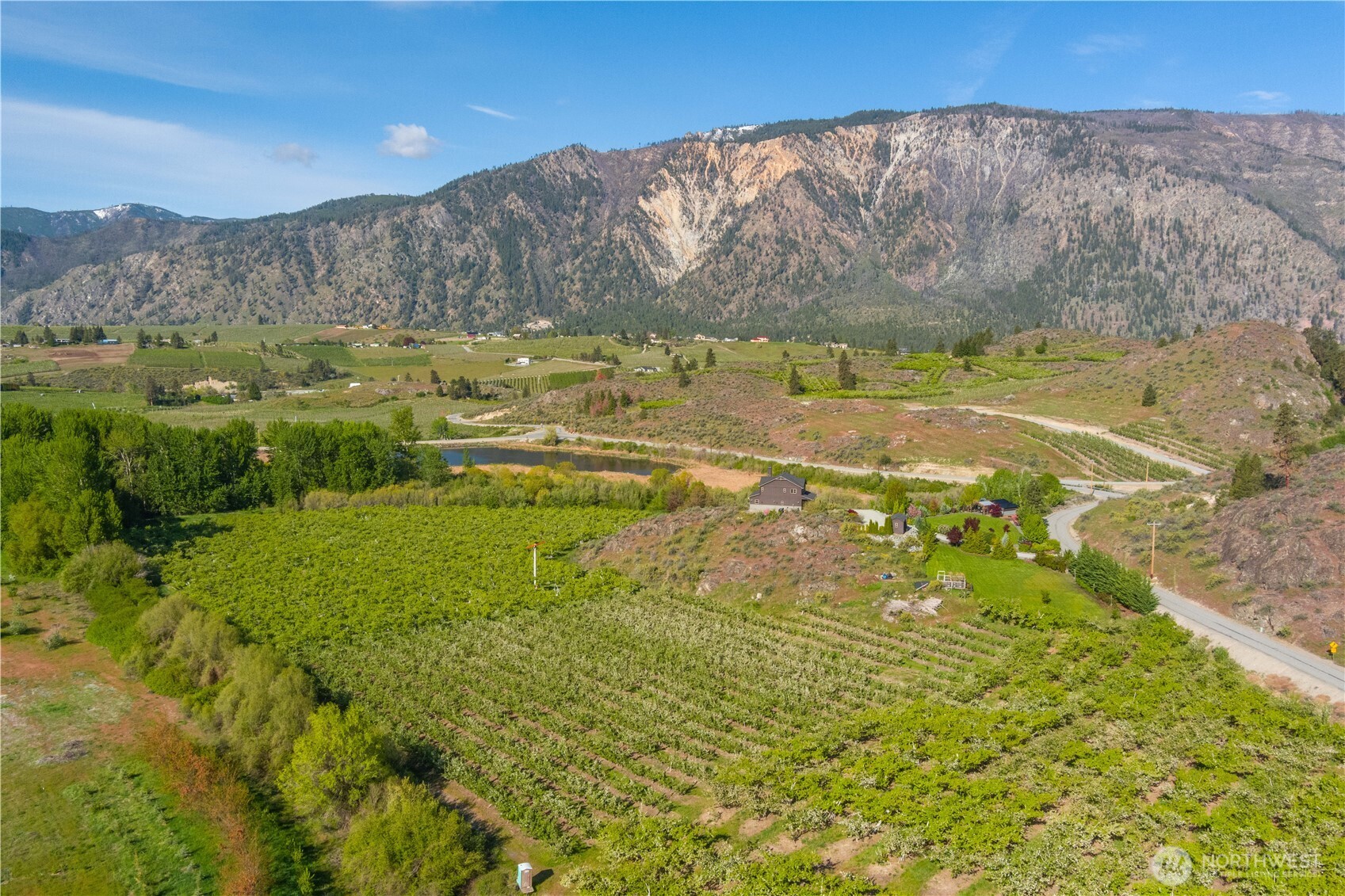 0 Lower Joe Creek Road Manson, WA 98831 - Photo 6 of 10 a view of a lake with mountains in the background