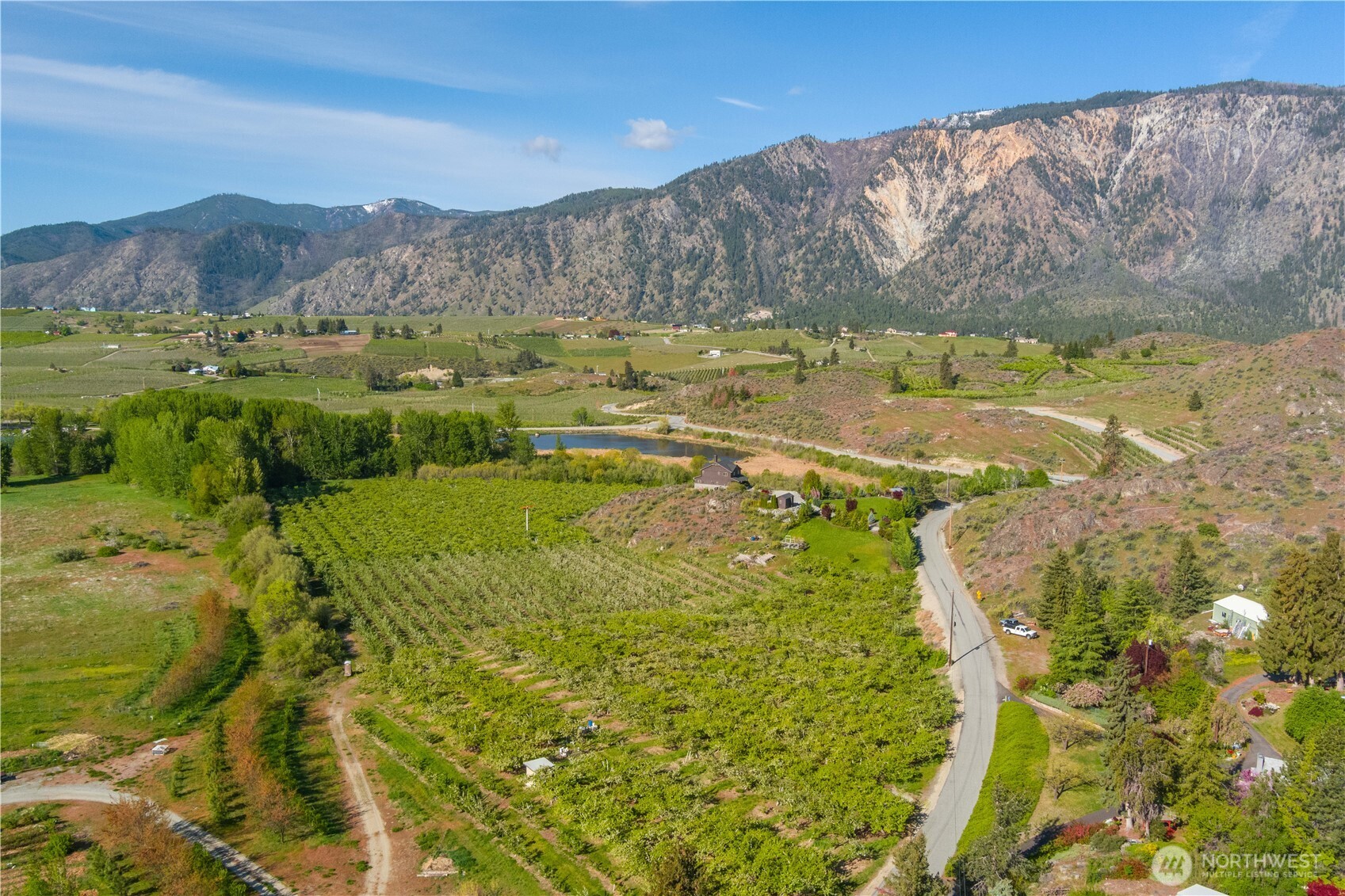 0 Lower Joe Creek Road Manson, WA 98831 - Photo 8 of 10 a view of a lake with a mountain in the background
