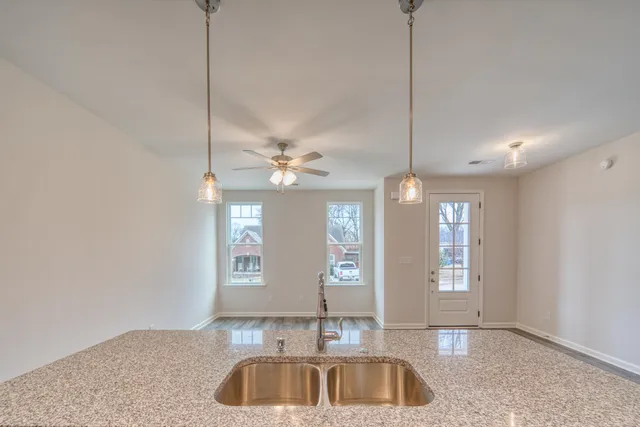 a view of a house with a large tree