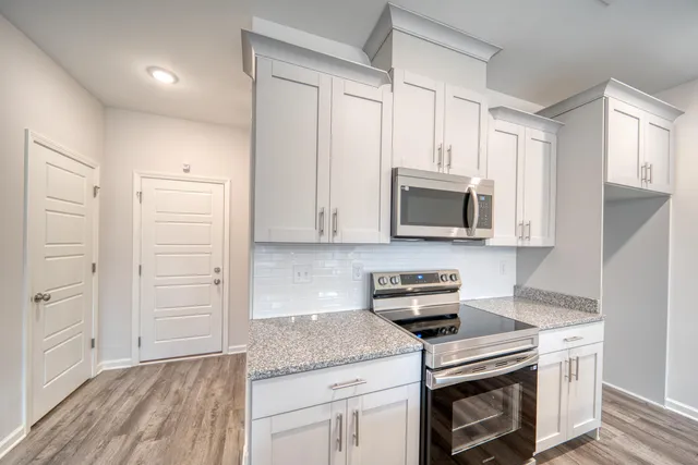 a view of a kitchen counter top space and a sink