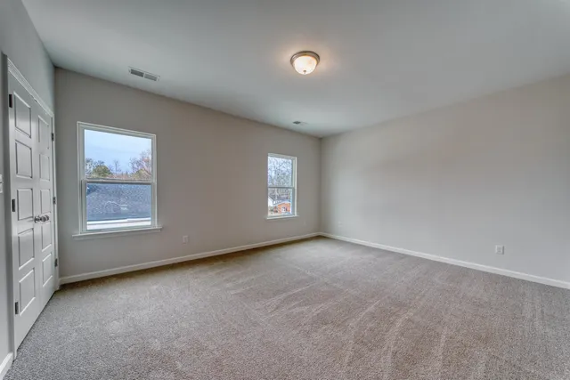 a view of an empty room and a window