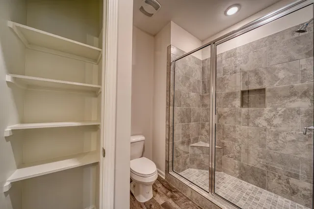 a view of a room with racks on the wall