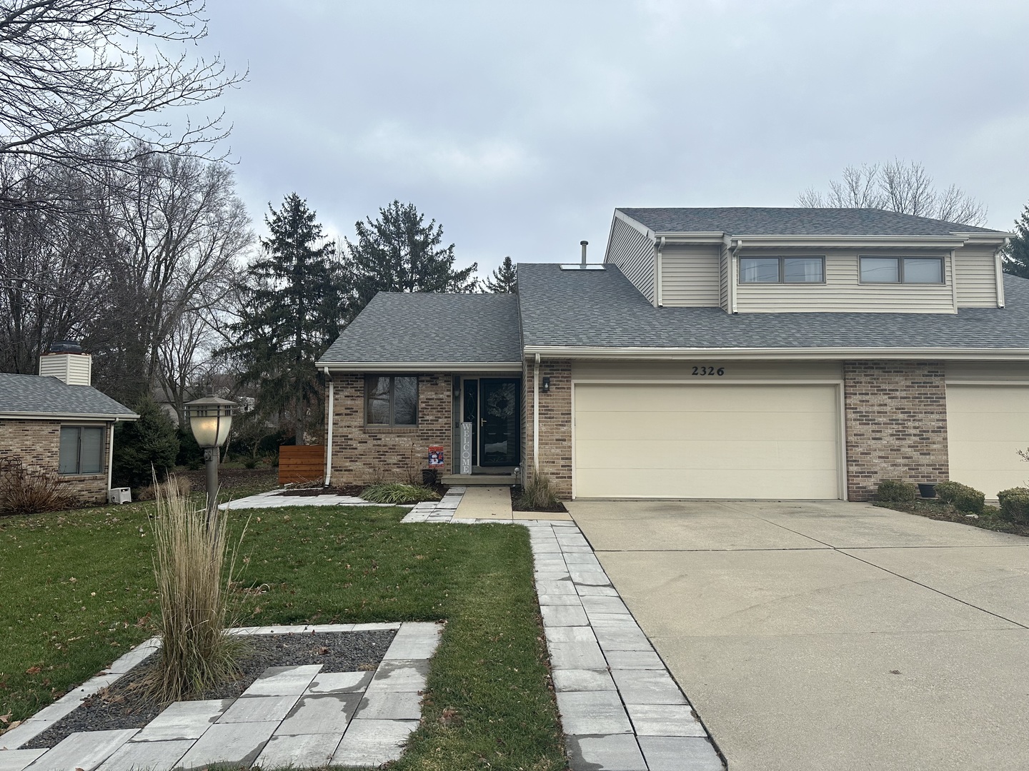 2326 South Staley Road Champaign, IL 61822 - Photo 1 of 7 a front view of a house with a yard and trees