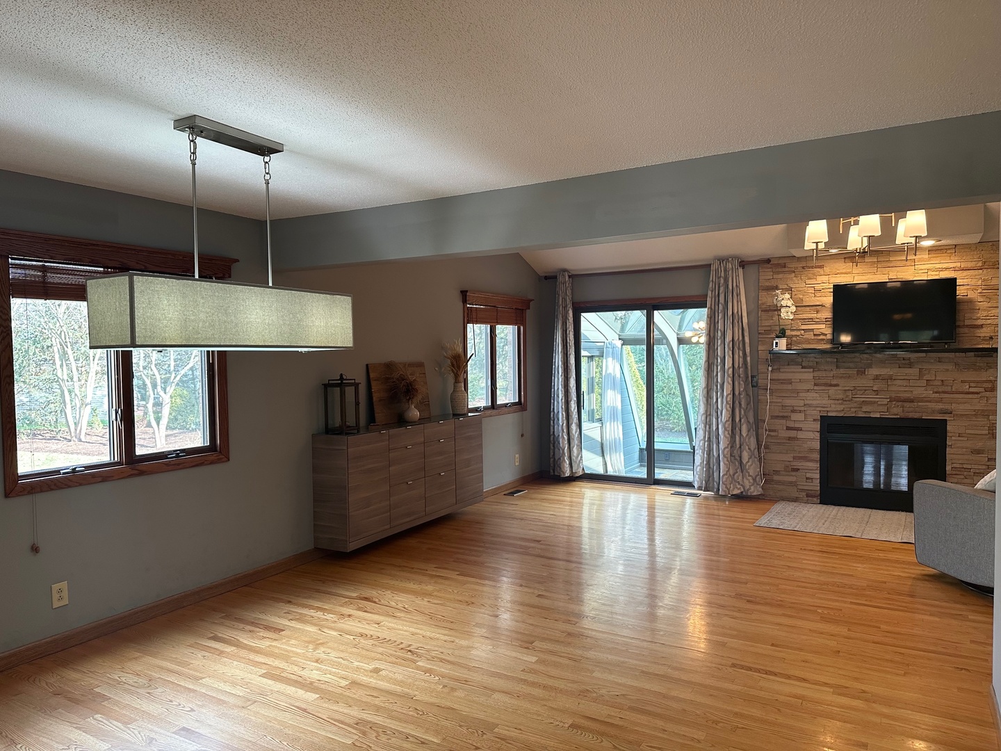 2326 South Staley Road Champaign, IL 61822 - Photo 2 of 7 a view of a living room a fireplace and windows