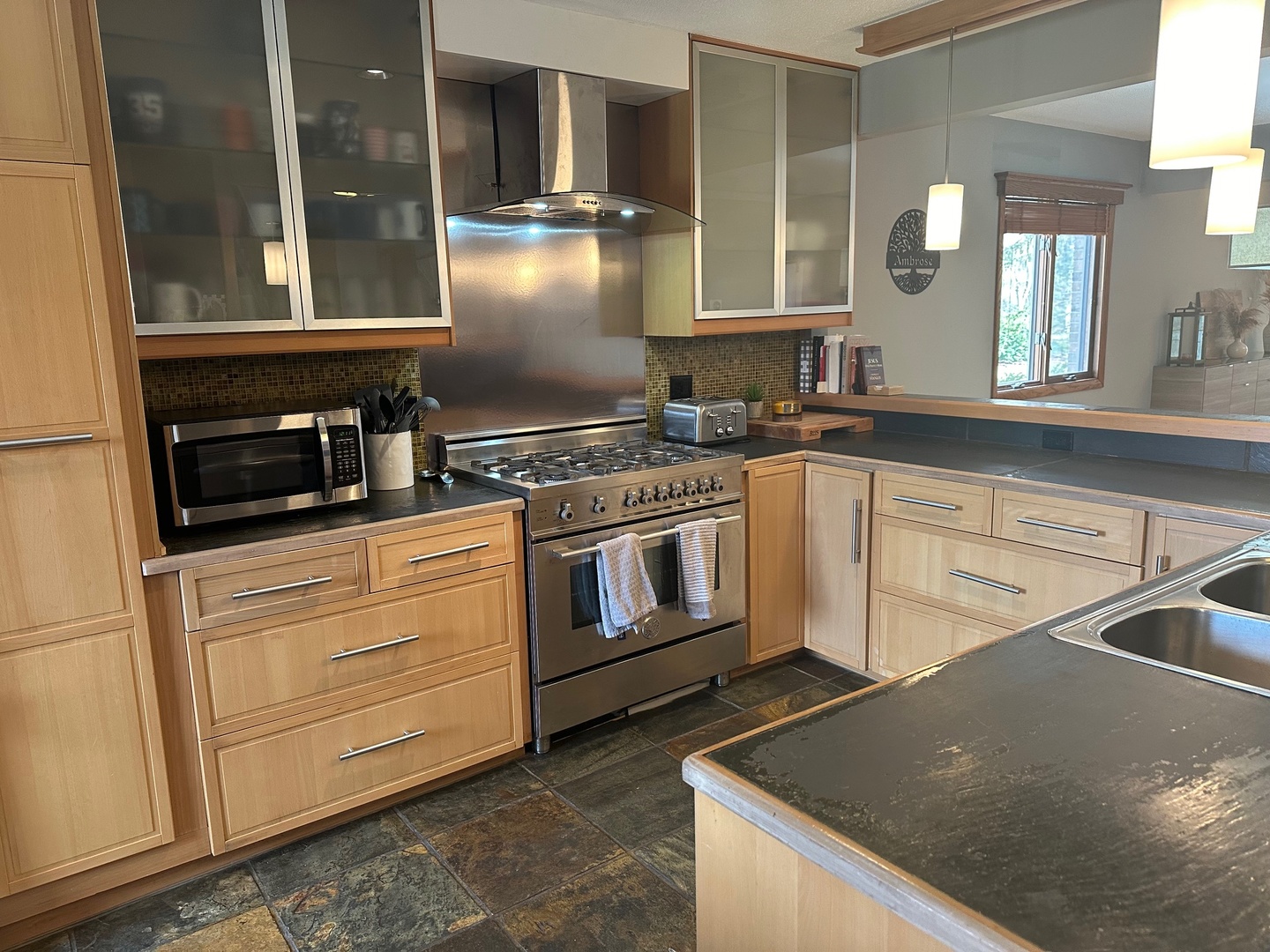 2326 South Staley Road Champaign, IL 61822 - Photo 3 of 7 a kitchen with stainless steel appliances granite countertop a sink a stove and a microwave
