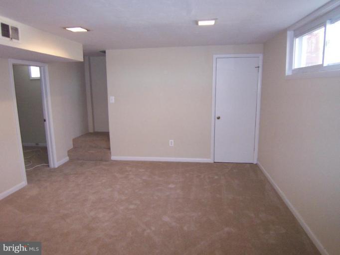 8110 Phelps Place District Heights, MD 20747 - Photo 12 of 13 a view of an empty room with a window