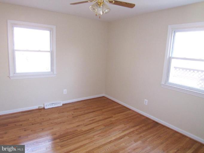 8110 Phelps Place District Heights, MD 20747 - Photo 8 of 13 an empty room with a window