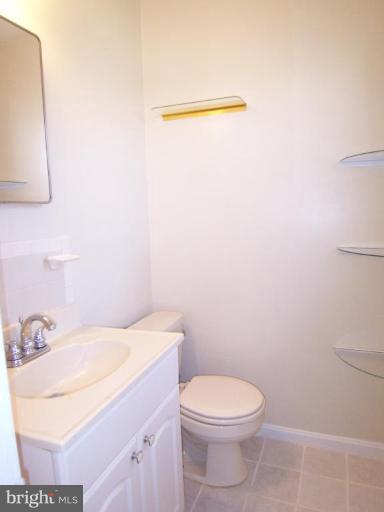 8110 Phelps Place District Heights, MD 20747 - Photo 9 of 13 a bathroom with a sink a toilet and mirror